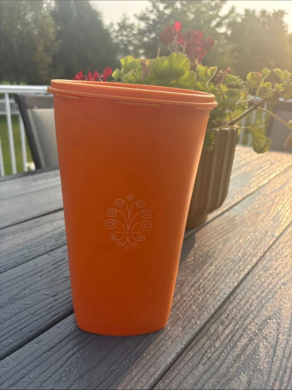 Tupperware Orange Storage Container with Decorative Emblem